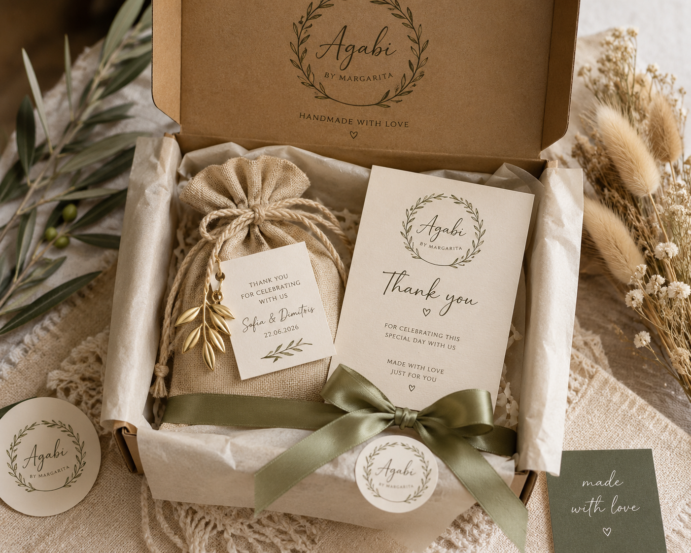 Kraft gift box lined with ivory tissue, sage ribbon, thank-you card and personalised kraft tags